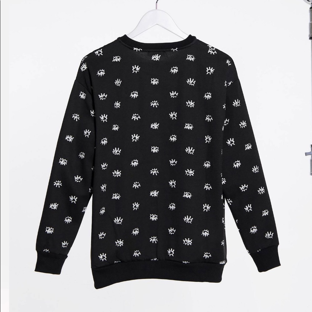 Topshop eye graphic sweatshirt in black. Medium.